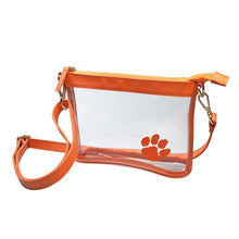 Load image into Gallery viewer, This is a Capri Designs clear bag with a removable strap and orange accents with the Clemson University logo in the corner.  Go Tigers!