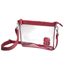 Load image into Gallery viewer, This is a Capri Designs clear bag with a removable strap and red accents with the North Carolina State University logo in the corner.  Go NC State Wolfpack!